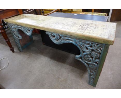 A carved painted wooden bench 
