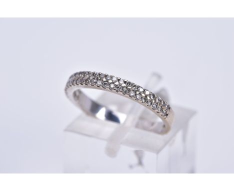 AN 18CT WHITE GOLD DIAMOND RING, a half hoop design set with two rows of claw set round brilliant cut diamonds, hallmarked 18