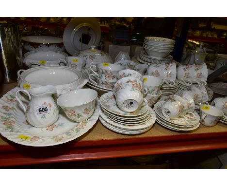 A WEDGWOOD COTTAGE ROSE PATTERN DINNER SERVICE, comprising meat platter, three twin handled tureens (only one with a cover), 
