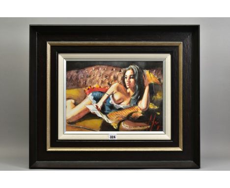 FABIAN PEREZ (ARGENTINA 1967) 'THE LETTER II', a scantily clad female figure relaxing on a leather sofa, signed bottom right,