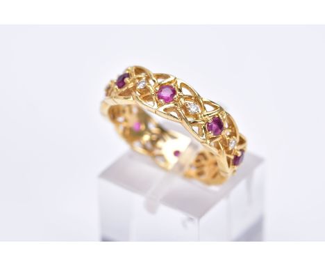 AN 18CT GOLD RUBY AND DIAMOND WIDE BAND RING, of openwork design set with alternating circular cut rubies and round brilliant