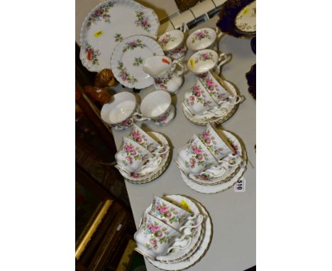 ROYAL ALBERT 'MOSS ROSE' TEA WARES, comprising eleven cups, twelve saucers, four side plates, sandwich plate, milk and sugar,