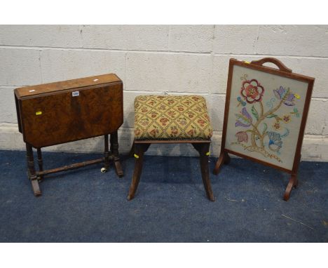 AN EDWARDIAN BURR WALNUT SUTHERLAND TABLE, together with a square mahogany stool (sd) and an oak firescreen (3)