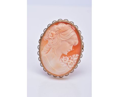 A MODERN 9CT GOLD CAMEO SHELL BROOCH, depicting a maiden in profile, measuring approximately 46mm x 36mm, rope edge looped bo