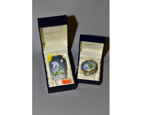 TWO BOXED MOORCROFT ENAMEL 'SNOWDROP' ITEMS, comprising of a pill box and small vase, height 7cm, both stamped 'Moorcroft' an