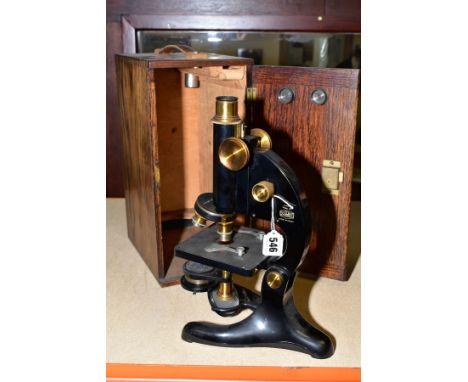 AN OAK CASED BECK OF LONDON MICROSCOPE, model 29, one spare lens in slide out rack, approximate height 31cm, case height 34cm