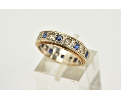 A 9CT WHITE GOLD SAPPHIRE ETERNITY RING, the central white gold panel set with square cut sapphires interspaced with colourle