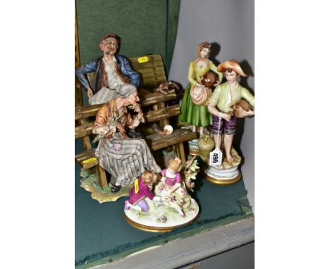 FOUR CAPO DI MONTE FIGURES AND ANOTHER CONTINENTAL PORCELAIN FIGURE GROUP, comprising a pair of male and female water carrier
