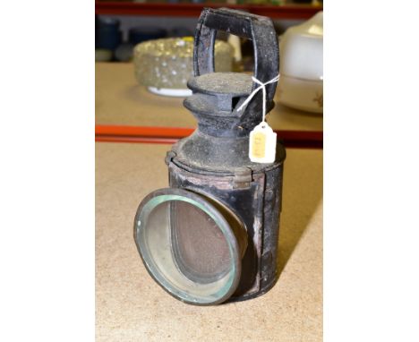 AN UNMARKED THREE ASPECT RAILWAY HAND LAMP, complete with reservoir, burner and mirror, only red lens remains, other two are 