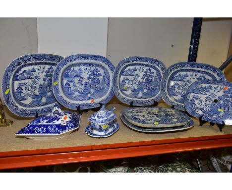 FIVE WILLOW PATTERN BLUE AND WHITE PLATTERS, length approximately 41cm, two drainers, tureen with lid and ladle and a Copelan