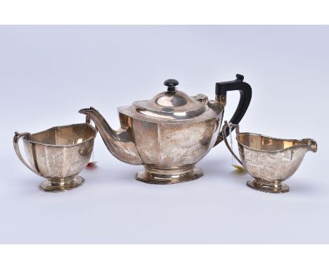 A GEORGE vi SILVER THREE TEA SERVICE OF SHAPED RECTANGULAR FORM, comprising tea pots, milk jug and twin handled sugar bowl, m