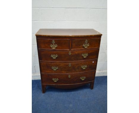 A GEORGIAN MAHOGANY AND CROSSBANDED BOWFRONT CHEST OF TWO SHORT AND THREE LONG DRAWERS, with brass swan neck handles, pierced