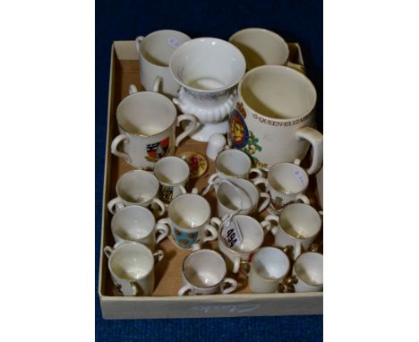 A TRAY OF CRESTED CHINA TYGS AND ROYAL COMMEMORATIVE MUG, ETC, including a Royal Doulton Nursery Rhymes mug, a Royal Worceste