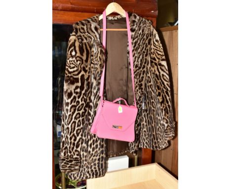 A SHORT VINTAGE OSELOT FUR COAT, with side seam pockets, lined with embroidered initials to bottom right hand side length app