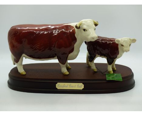 Beswick Hereford cow and calf mounted on a wooden base. no cracks or chips. UK P&amp;P Group 2 (£20+VAT for the first lot and