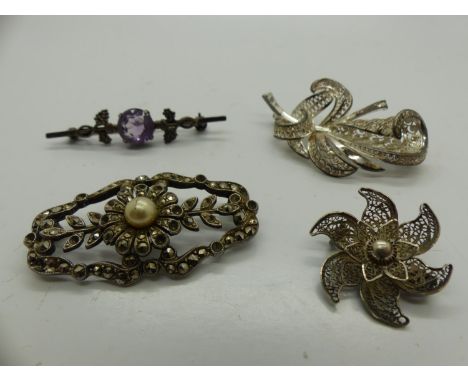 Four silver brooches, including a stone set example, largest L: 50 mm. UK P&amp;P Group 1 (£16+VAT for the first lot and £2+V