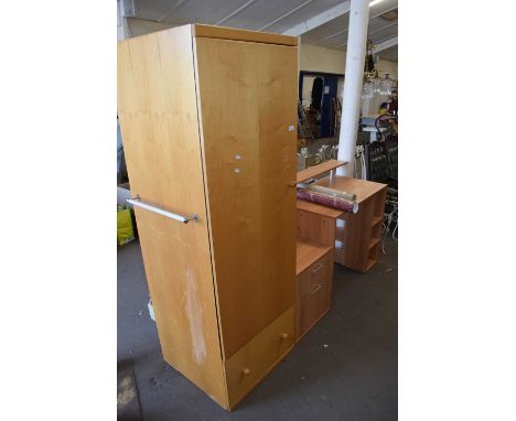 A modern light wood finish wardrobe and desk