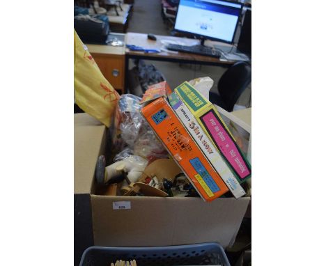 A box of various toys, carpet bowls, jigsaw puzzles etc