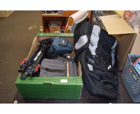 Box of various camera tripods, cases etc