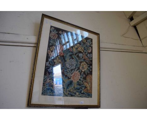 A tapestry picture of flowers and animals, framed and glazed