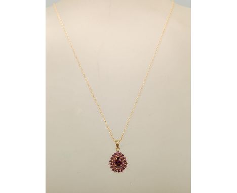 A 9ct gold amethyst and rodalite pendant 9ct gold necklace set to a rope twist mesh chain, measures 18 inches in length and w