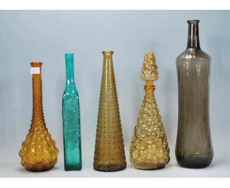 A collection of retro vintage coloured glass bottles / vases to include two Genie style bottles one having stopper to the top