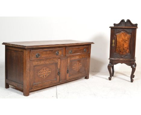 A 1920's end of bed oak low cabinet. Raised on squared legs with double door cupboard beneath 2 short drawers above. Together