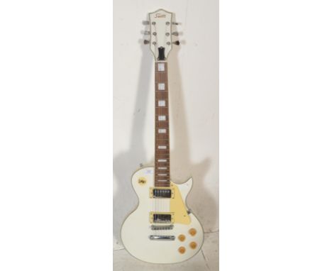 A Swift made six string Gibson Les Paul style electric guitar having a white body with cream pick guard, twin humbucker picku