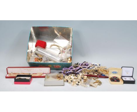 A good collection of vintage and latter costume jewellery to include faux pearl necklaces, rolled gold bangle and other gold 