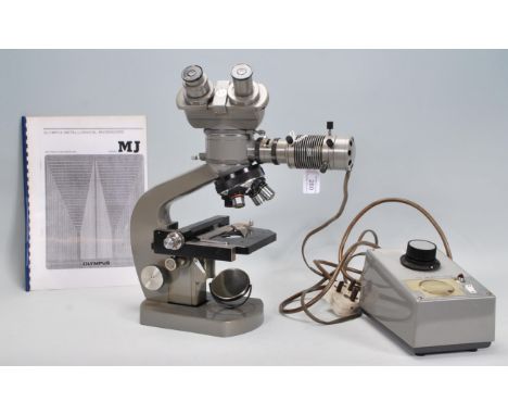 An Olympus Optical Company Ltd, metallurgical microscope, model MJ fitted&nbsp;K20X eyepieces. Together with a selection of l