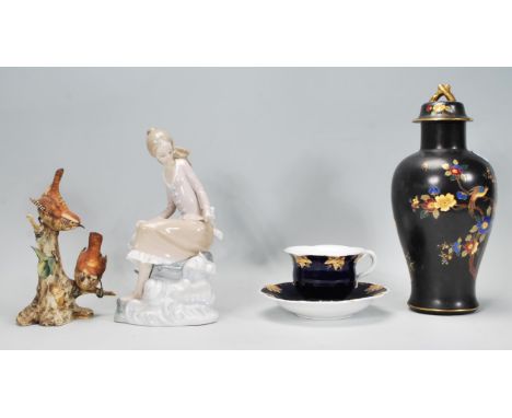 A collection of 20th Century ceramics to include a 1930's Carlton Ware lidded baluster vase having a black ground with floral