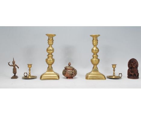 A collection of items to include a pair of 19th century brass candlesticks, pair of Indian brass candlesticks, thai small bro