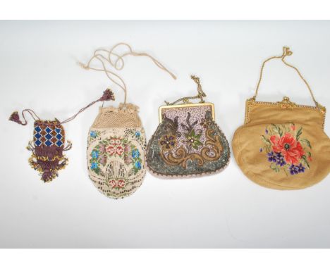 A group of vintage 20th Century evening handbags to include a tapestry bag decorated with a flower to the front having a gilt
