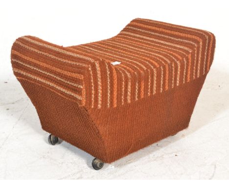 A retro vintage 20th Century pouffe / dressing table stool of saddle form upholstered in a woollen orange and brown fabric.&n