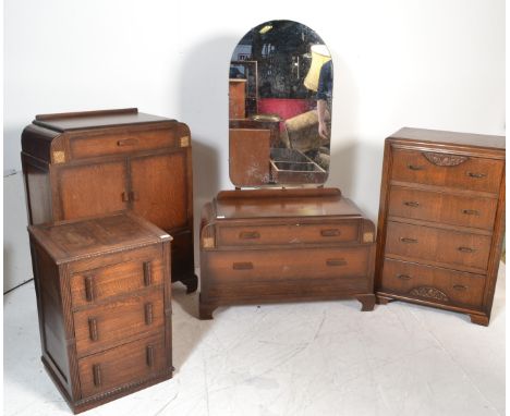 An early 20th Century Art Deco matching oak bedroom suite consisting of dressing table and matching tallboy together with two