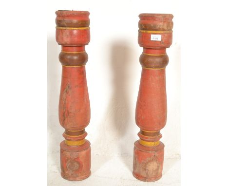 A pair of very large vintage 20th Century Indian&nbsp; hardwood painted floor standing candlestick holders of baluster form. 