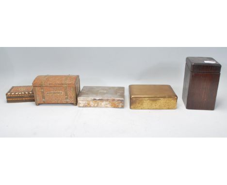 A collection of of tea caddies and cigarette boxes dating form the early 20th Century to include a copper and brass Arts and 