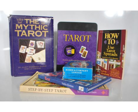 A group of three&nbsp;sets of Tarot cards to include a boxed 'The Mythic Tarot' by Juliet Sharman-Burke and Liz Greene having