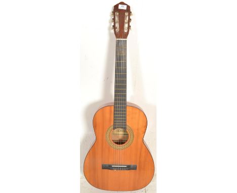 A vintage 20th Century six string acoustic six string classical Spanish style guitar, ebonised fret board with applied makers