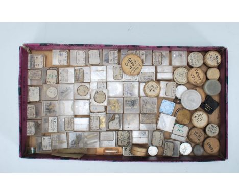 A collection of vintage 20th Century watch repairers watch parts for watch repairs, cogs, pins, screws etc.