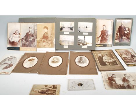 An early 20th Century black and white photograph album depicting landscape images from towns around the UK including Brixham,