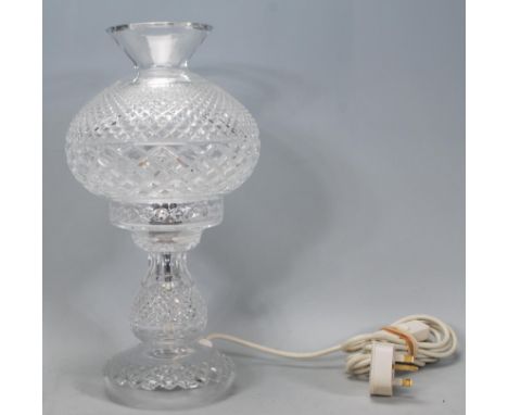 A 20th Century Waterford crystal cut glass crystal table lamp with removable shade, being hobnail cut with bulbous shade and 