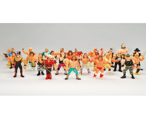 A collection of 1990's toy Titan sports wrestling action figures to include a wide selection of wrestlers with articulated po