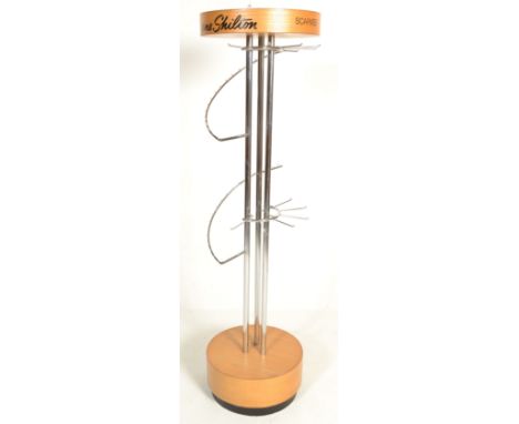 A 20th Century free standing revolving shop display advertising point of sale scarf stand for Ann Shilton, raised on a beech 