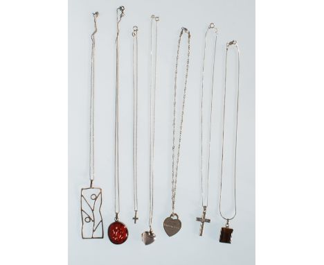 A selection of stamped 925 silver necklaces to include a twist chain necklace with a Tiffany &amp; Co heart lock pendant, a t