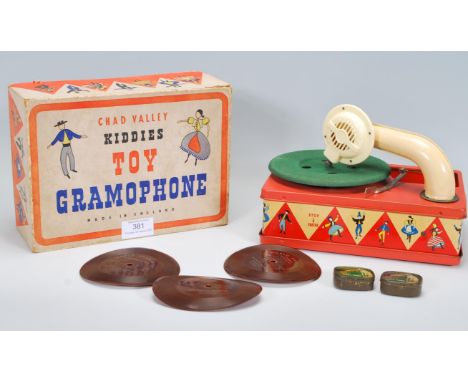 A vintage 20th Century Chad Valley Kiddies Toy Gramophone, in its original box with a selection of World Favourites records.&