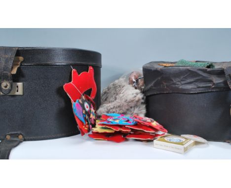Two vintage 20th Century hat boxes containing a variety of items to include compacts, a ladies cellulose handbag with the han