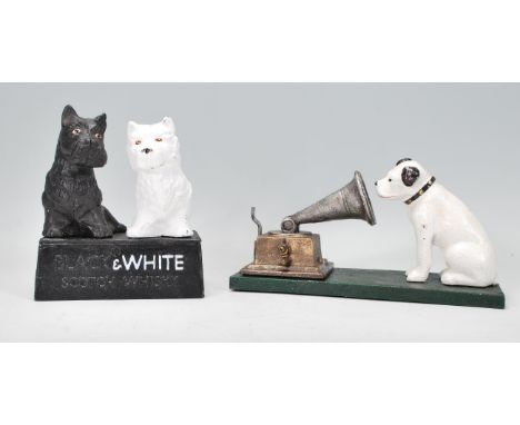 Two cast iron vintage style reproduction ornaments to include a HMV style dog and gramophone ornament and a Black &amp; White