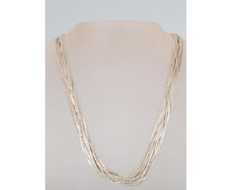 A stamped 925 silver multi chain necklace by Milor having a toggle clasp. Measures 19.5 inches. Weight 28.7g.&nbsp;
