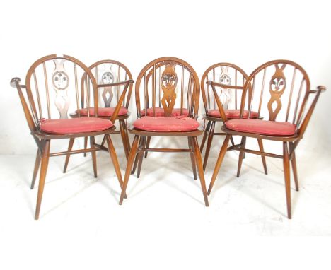 Lucian Ercolani - A set of six Ercol mid Century Old Colonial dining chairs of dark beech and elm wood. The chairs having spi